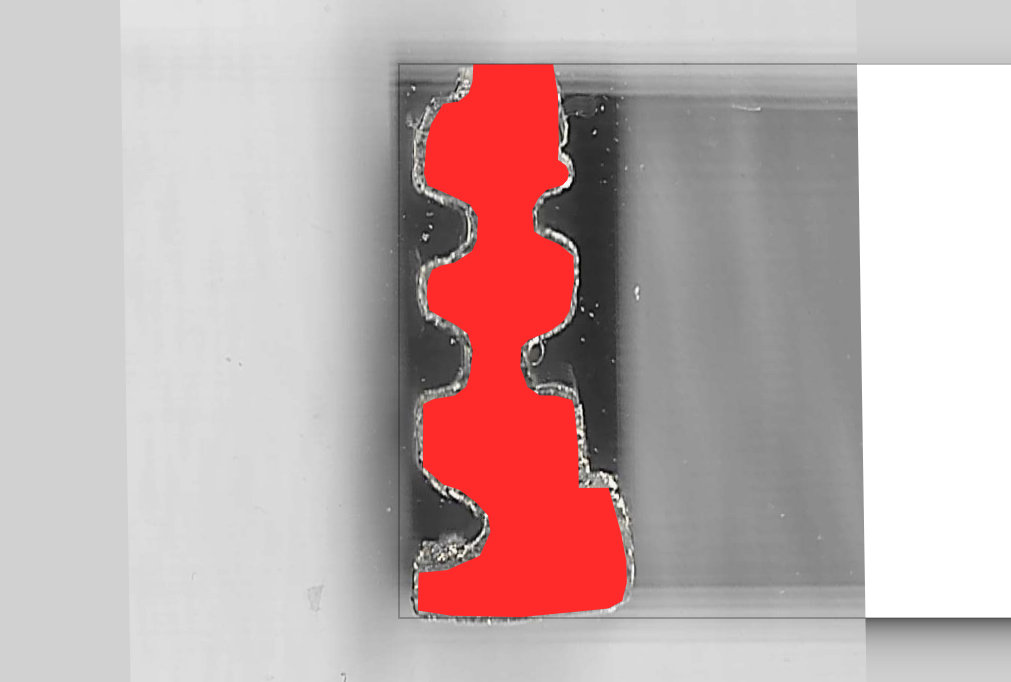 A screenshot of inkscape. There is red shape in the shape of the keyway traced uppon a scan of the key
