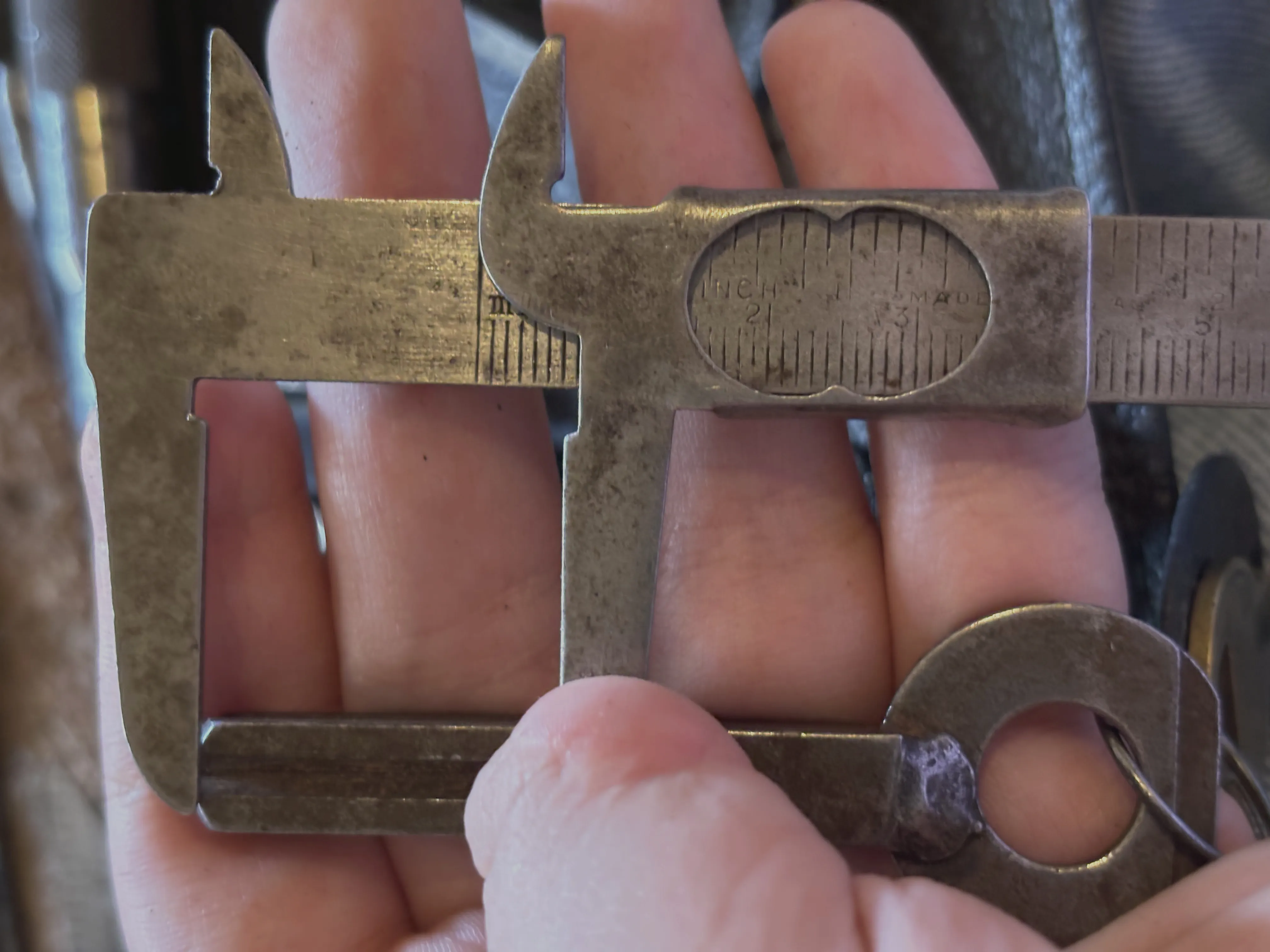 Antique calipers measuring the length of the key to be about 25 mm